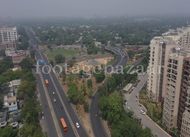 An aerial shot of the AIIMS flyover with running traffic in New Delhi, India