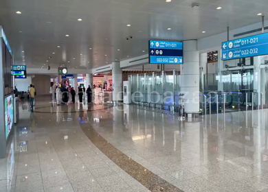 A Pan Shot of People at DXB Terminal 1, Dubai Airport,UAE 