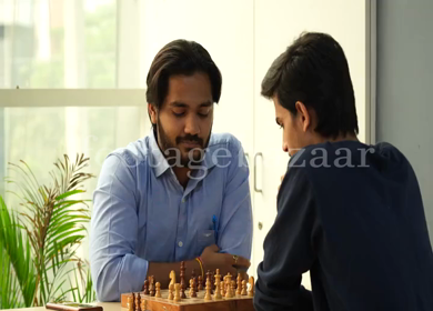 Shot of Indian colleagues playing chess 